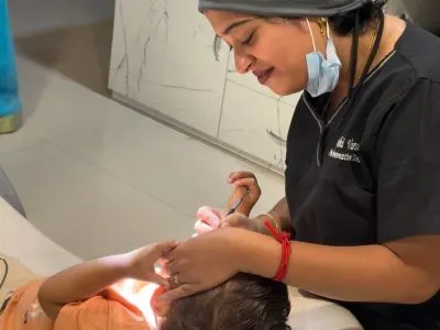 Pediatric dentist providing painless dental care for kids in Tiruppur